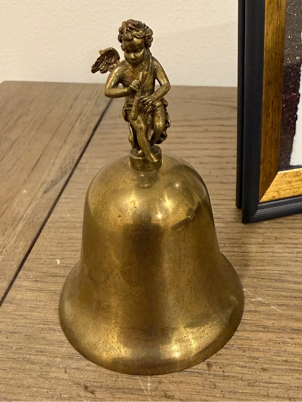 Vintage brass cherub hand bell made in Hong Kong